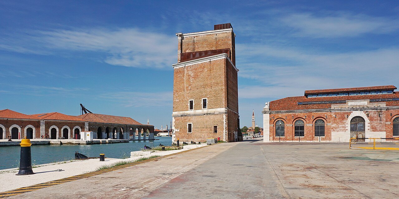 A tower and brick sheds on the northern quays of the Arsenale