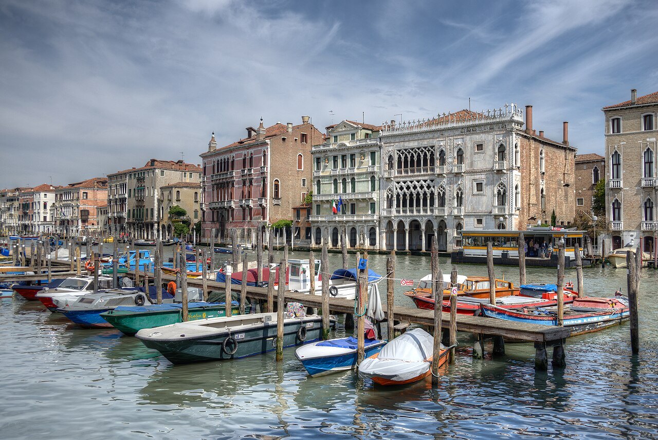 Boats moored along the Grand Canal before its palaces