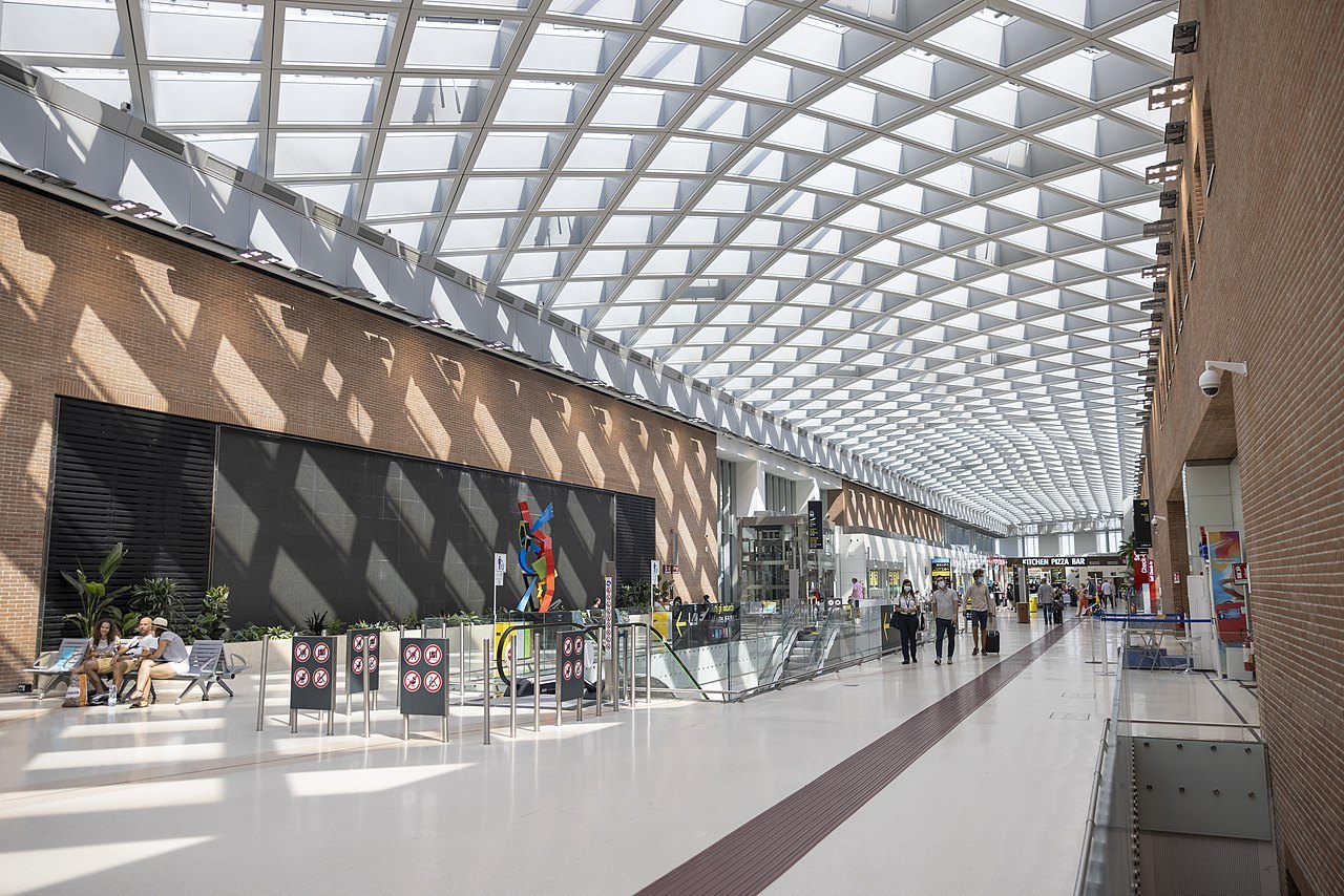 The long glass-roofed walkway of Marco Polo Airport's terminal
