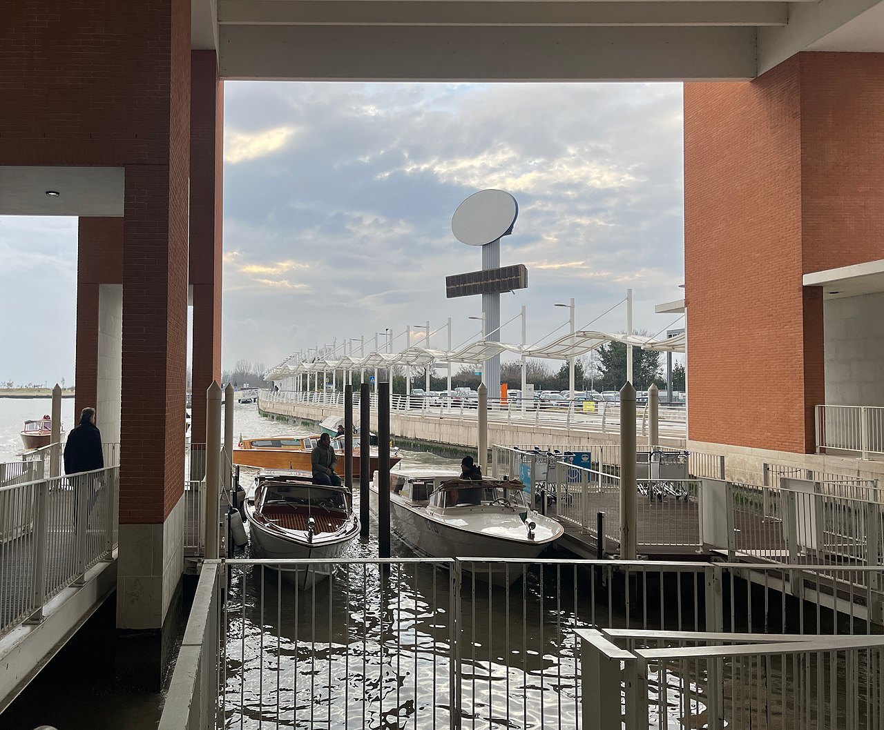The airport's water terminal, boats waiting at the pontoon