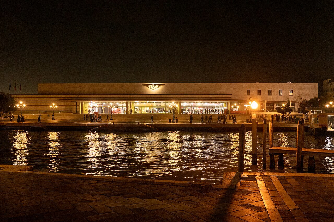 Santa Lucia station lit at night, across the Grand Canal