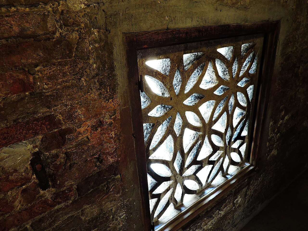 A stone-screened window inside the Bridge of Sighs