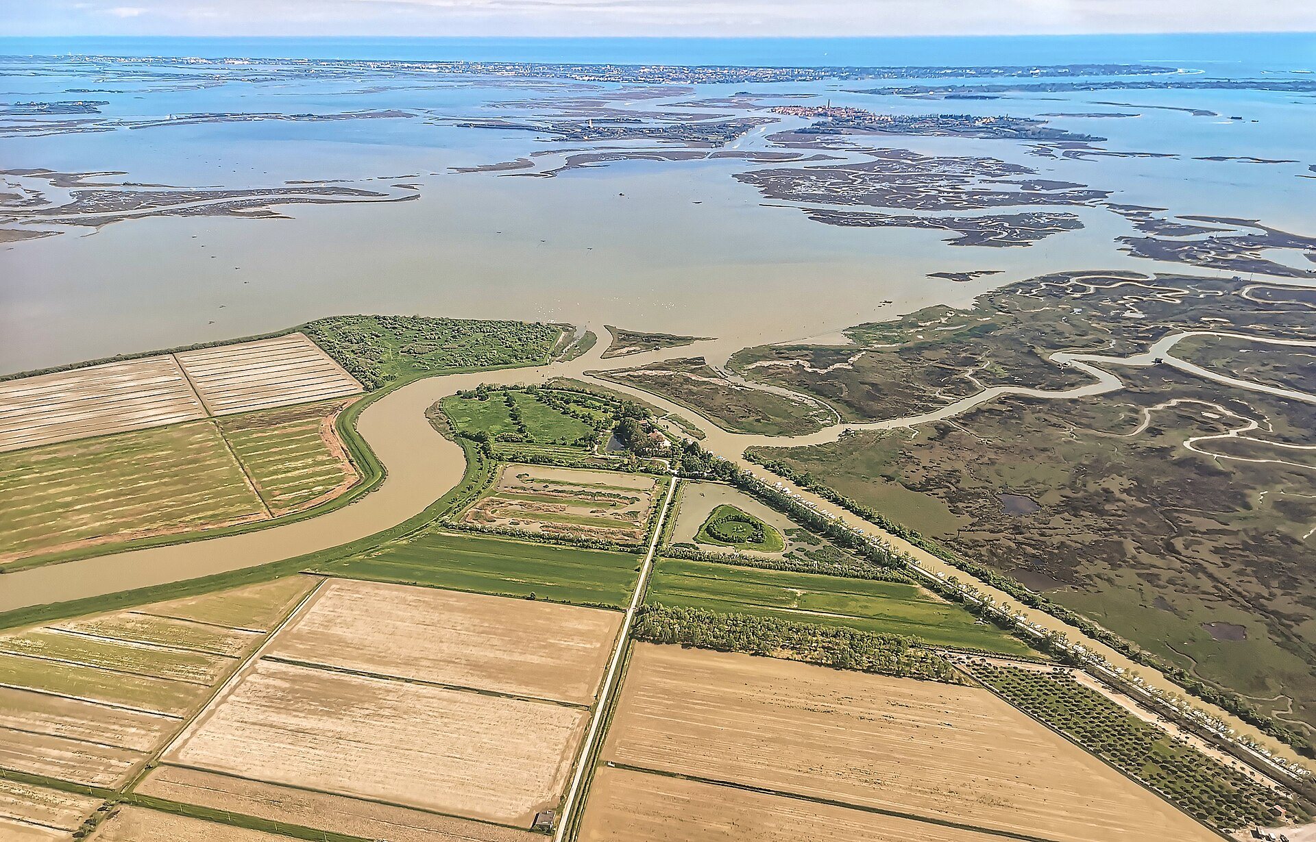 The salt marshes and fields at the edge of the lagoon, from the air