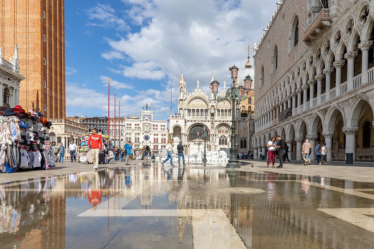 High water reflecting the Piazzetta and the Doge's Palace