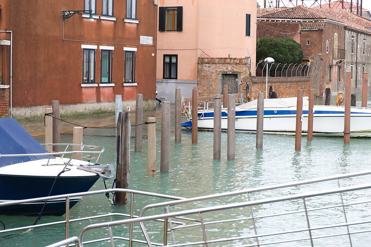 High water around the mooring posts of a Castello fondamenta