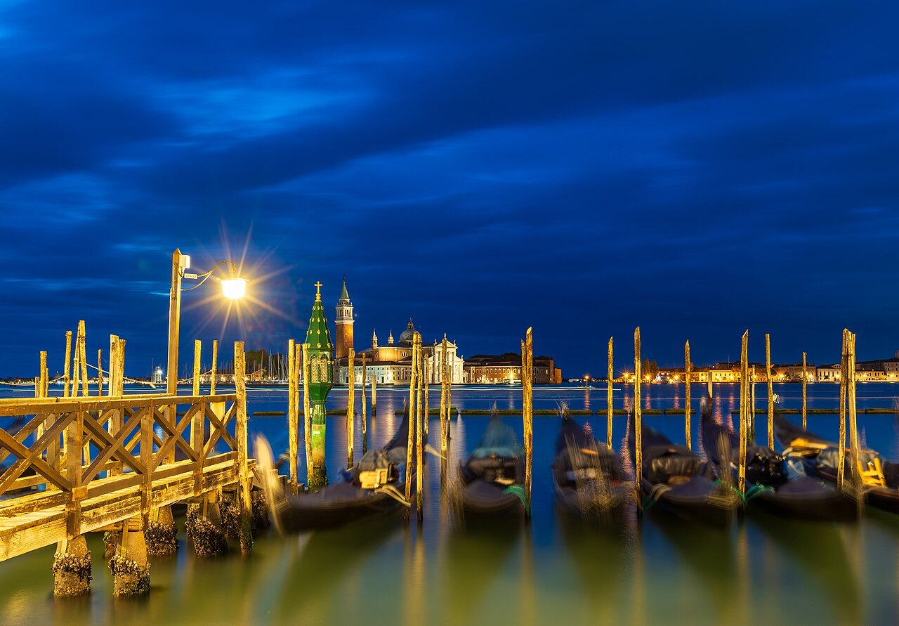 Gondolas moored at the Molo at dusk, San Giorgio beyond