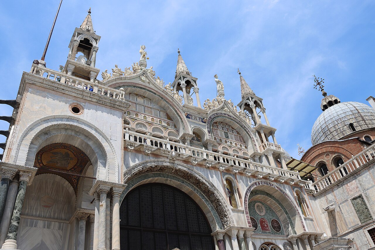 The upper front of St Mark's, its domes and pinnacles
