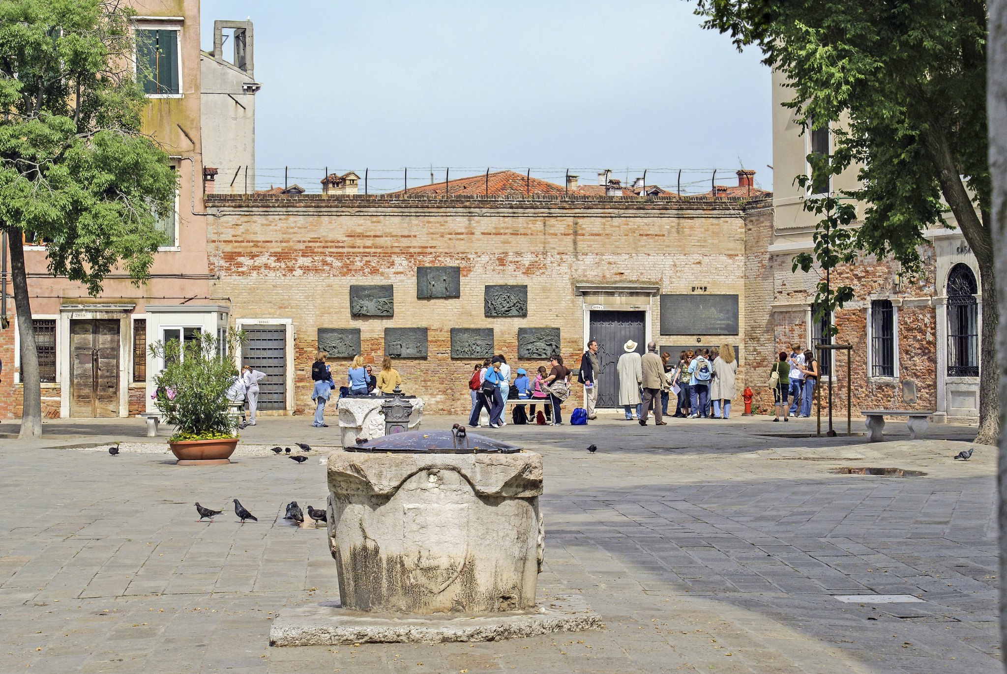 The Campo del Ghetto Nuovo, a wide open square with a wellhead and tall plain houses around it
