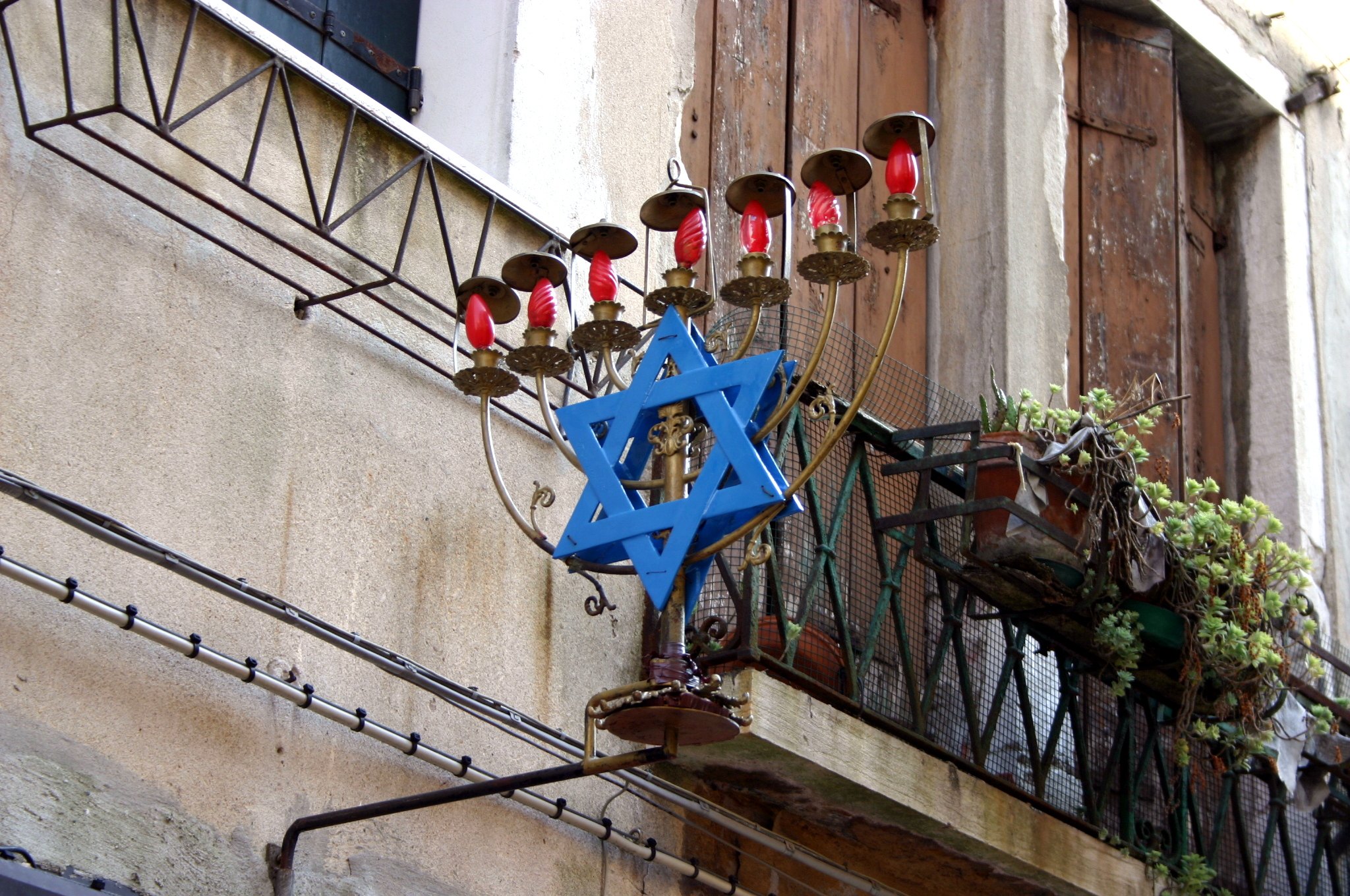 A Star of David lamp fixed to a wall in the Venetian Ghetto