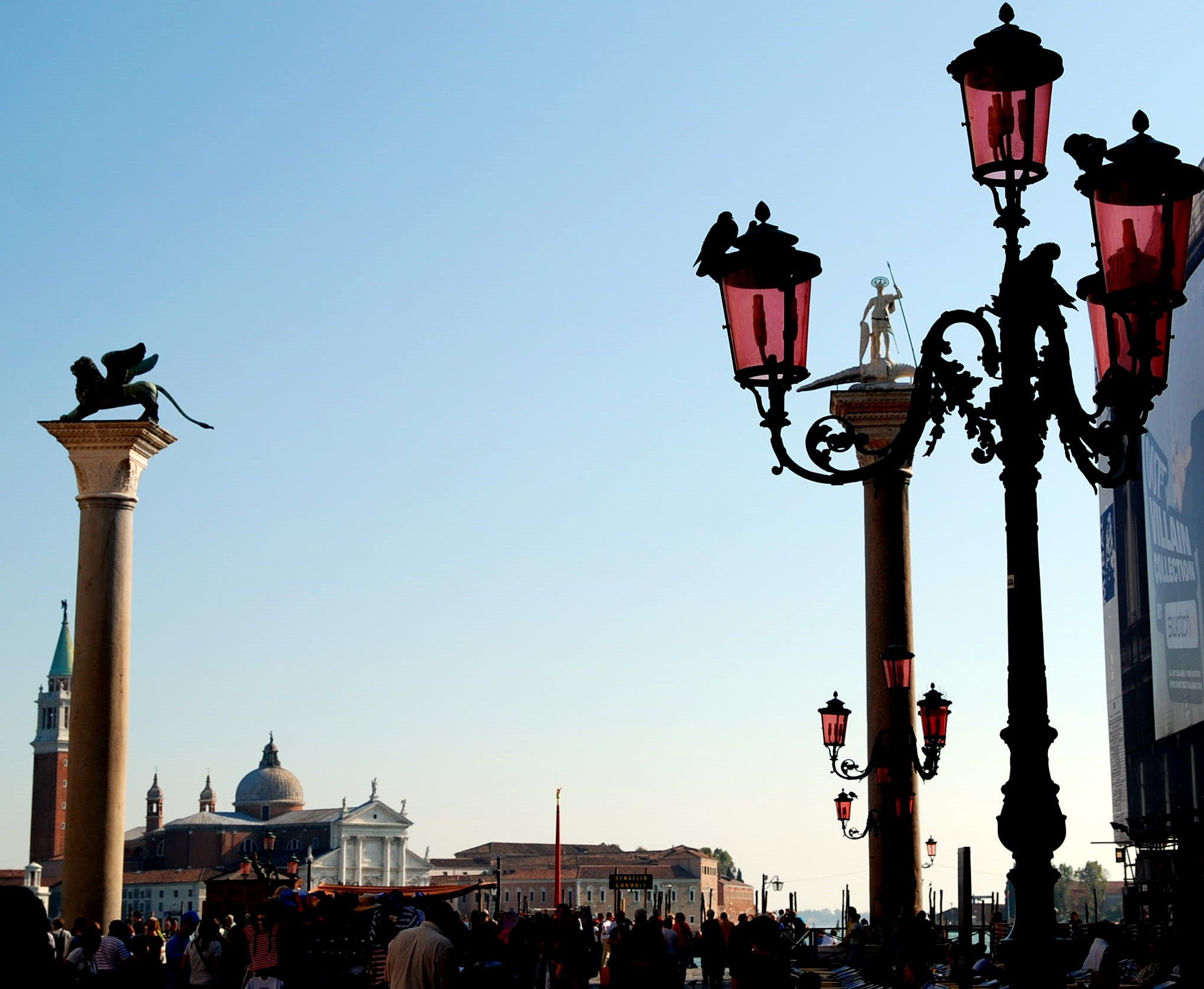 The two columns of the Piazzetta at dusk, the winged lion on one of them and San Giorgio across the water