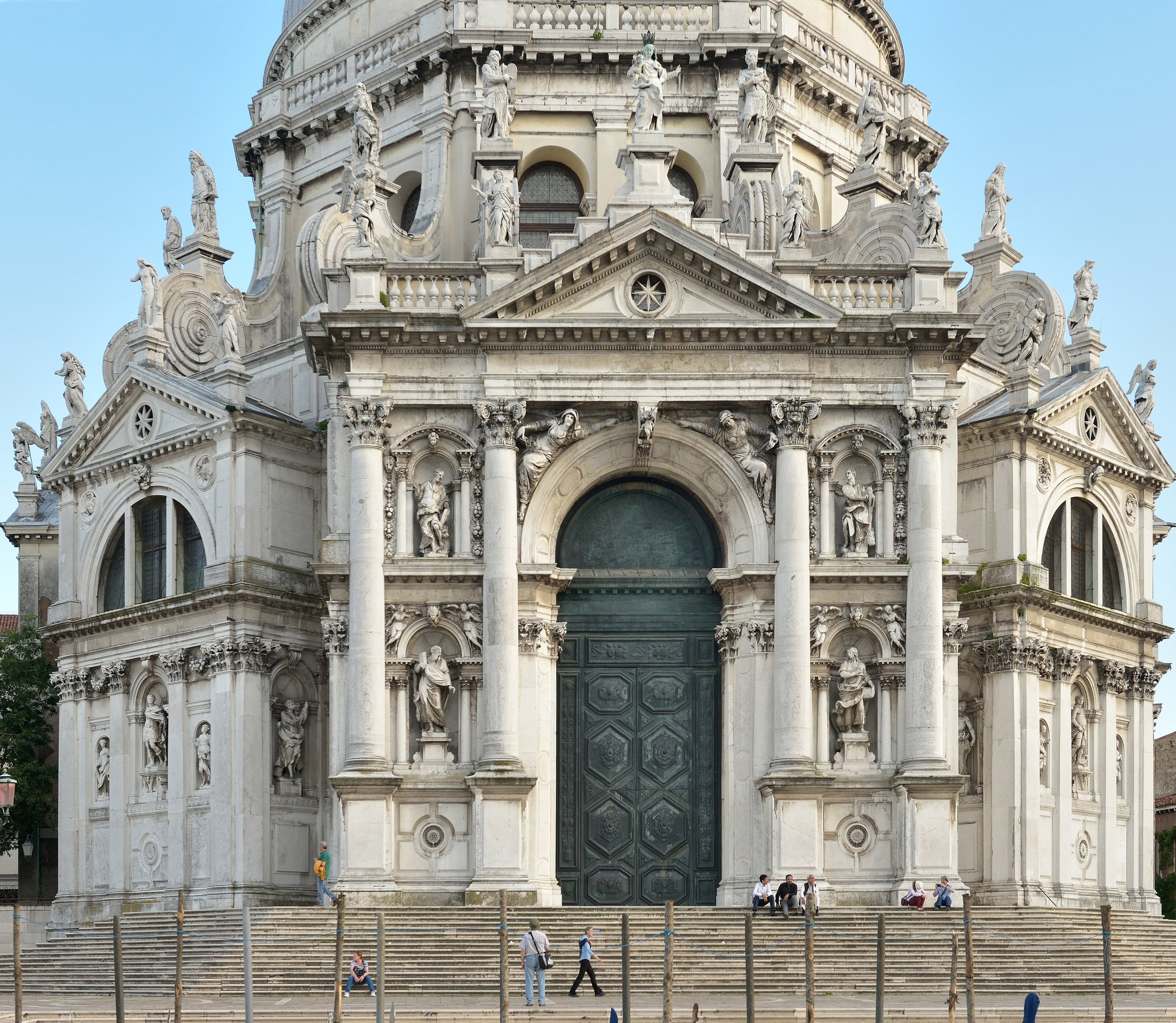 The front of Santa Maria della Salute, its great door and scrolled buttresses seen from the steps