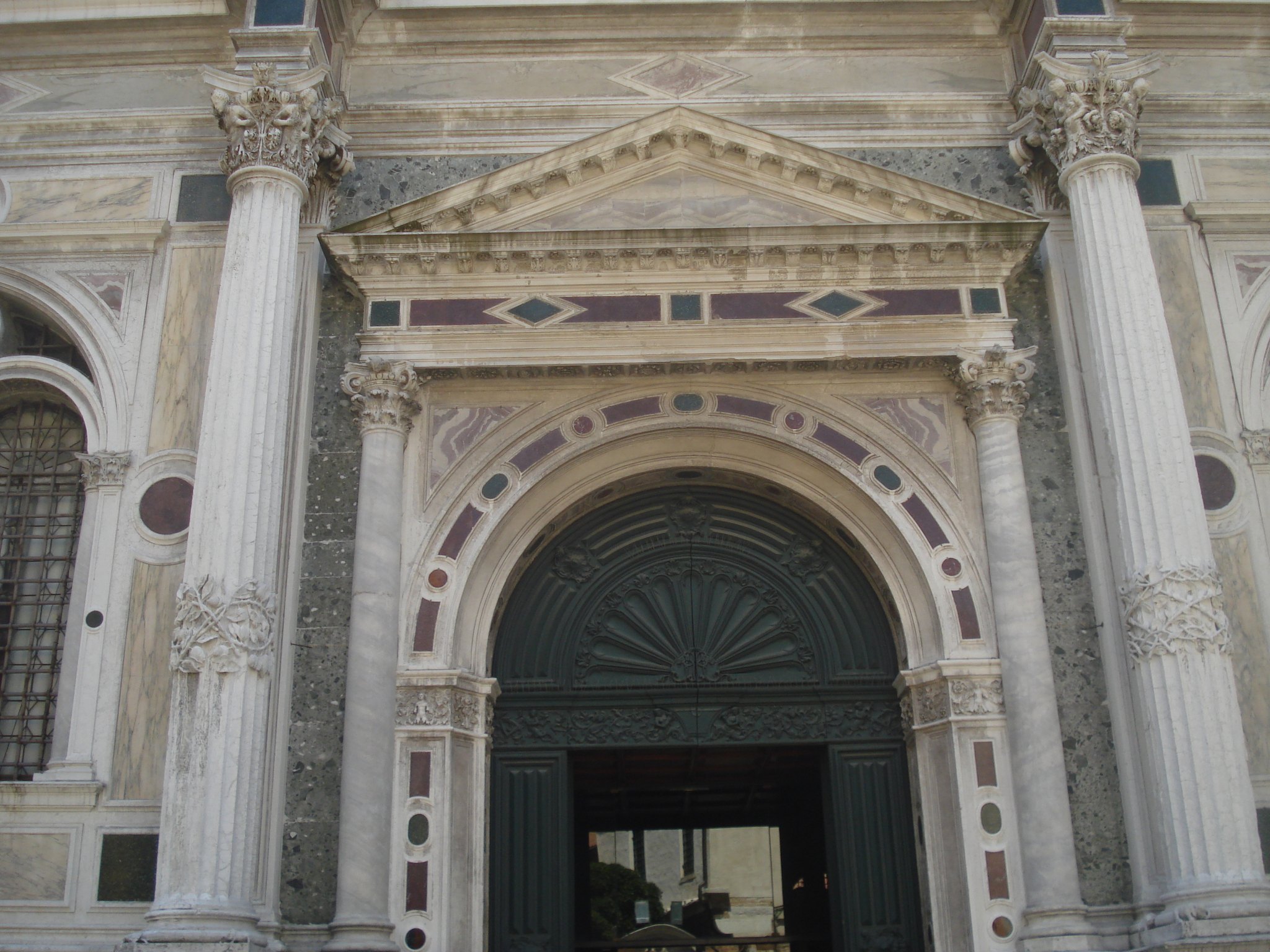 A carved capital on the front of the Scuola Grande di San Rocco