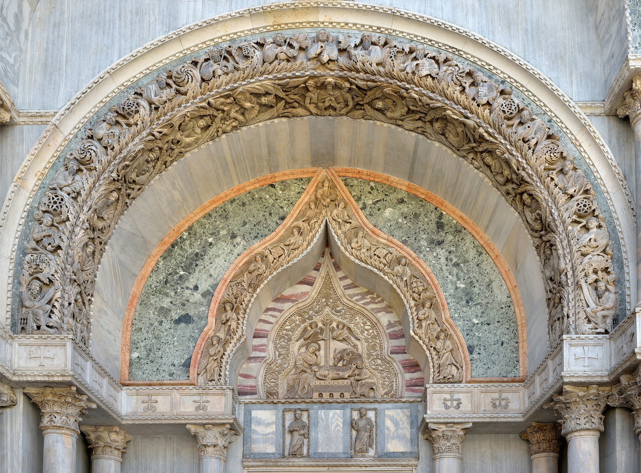 The north portal of St Mark's, a carved marble lunette of the Nativity under a pointed arch